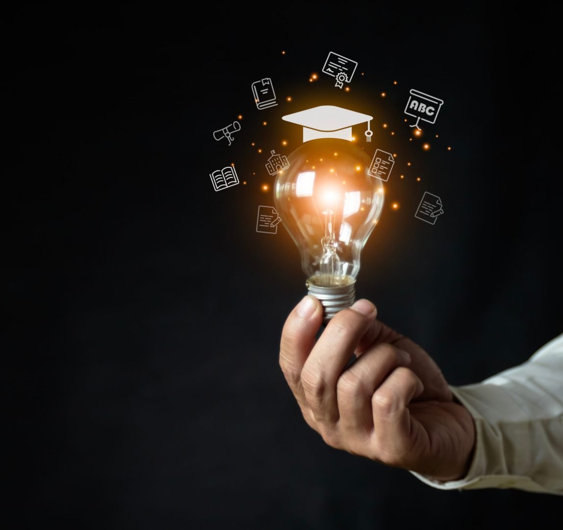 a man holding a light bulb showing his graduation cap internet education course A study of knowledge to creativity and problem-solving concepts for the e-learning graduate certificate course.